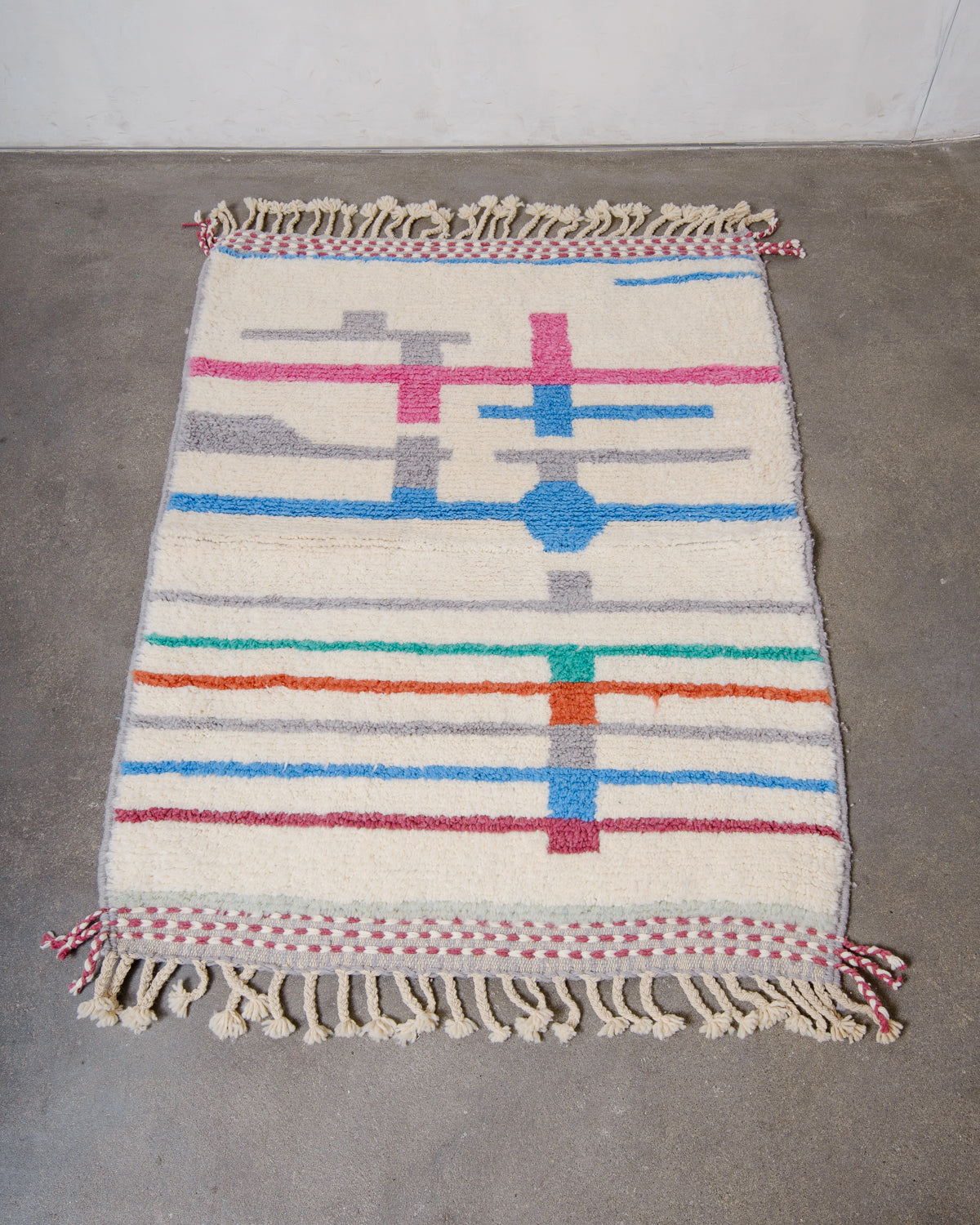 Modern, designer, handcrafted Berber rug from Morocco. Beniourain carpet with beautiful colours and patterns and fluffy wool texture.